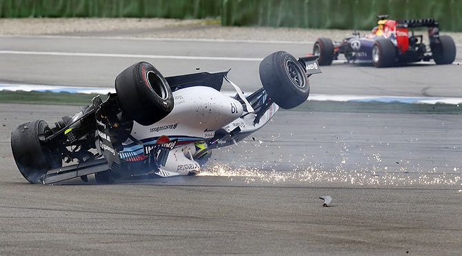 Formula One team Williams’s Brazilian driver, Felipe Massa crashes in the first corner after the start of the German F1 Grand Prix at the Hockenheim racing circuit, July 20
