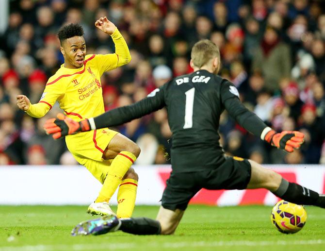 Manchester United goalkeeper David De Gea thwarts Raheem Sterling's attempt on goal