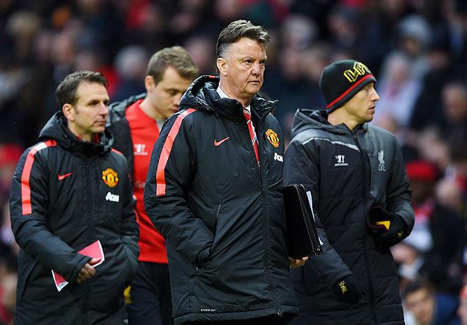 Manchester United Manager Louis van Gaal walks off at half-time during the English Premier League match between Manchester United and Liverpool on Sunday