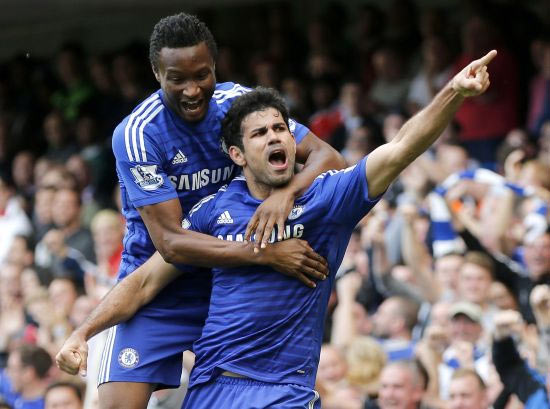 Chelsea's Diego Costa (R) celebrates with teammate John Obi Mikel after scoring a goal against Arsenal during their English Premier League soccer match
