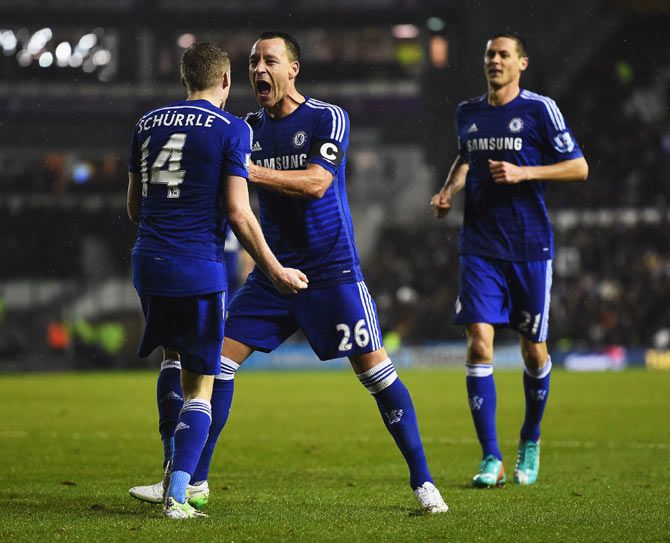 Chelsea Andre Schurrle celebrates his goal with John Terry during the Capital One League Cup quarter-final against Derby County at Pride Park Stadium in Derby, England, on Tuesday