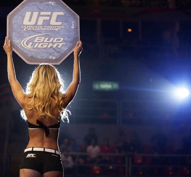 A ring girl announces a fight during the Ultimate Fighting Championship 