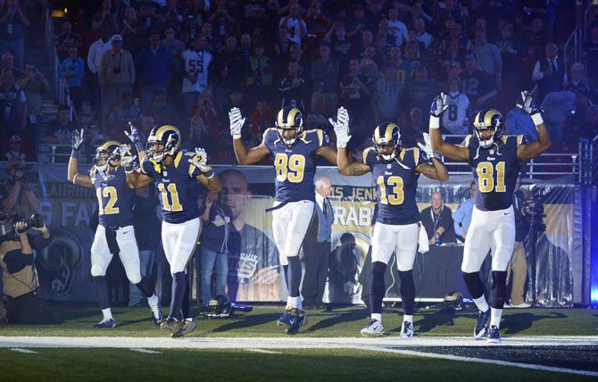  St. Louis Rams Stedman Bailey (12), Tavon Austin (11), Jared Cook (89), Chris Givens (13) and Kenny Britt (81) put their hands up to show support for Michael Brown before a game against the Oakland Raiders at the Edward Jones Dome on November 30