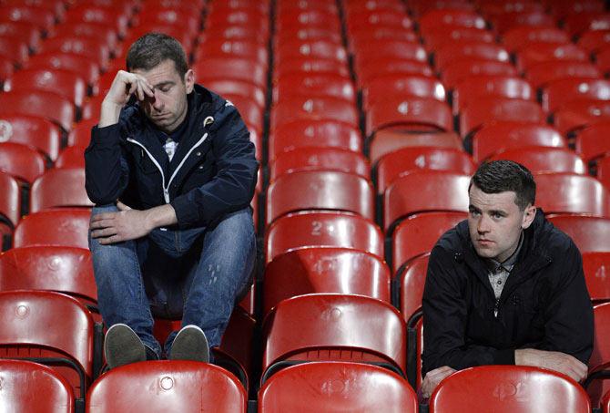 Liverpool fans react following their English Premier League match against Crystal Palace at Selhurst Park in London May 5, 2014. Liverpool dropped points in a 3-3 draw at Crystal Palace to effectively end their challenge for the 2013-14 English Premier League title