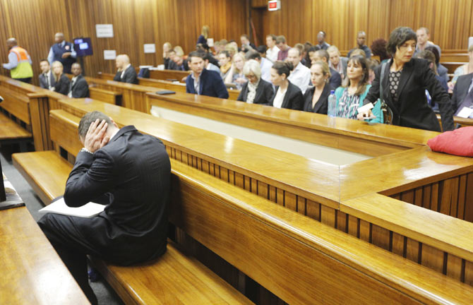 Oscar Pistorius sits in the dock ahead of the second day of the murder trial at the North Gauteng High Court in Pretoria, on March 4. Photograph: Kim Ludbrook/Pool/Reuters