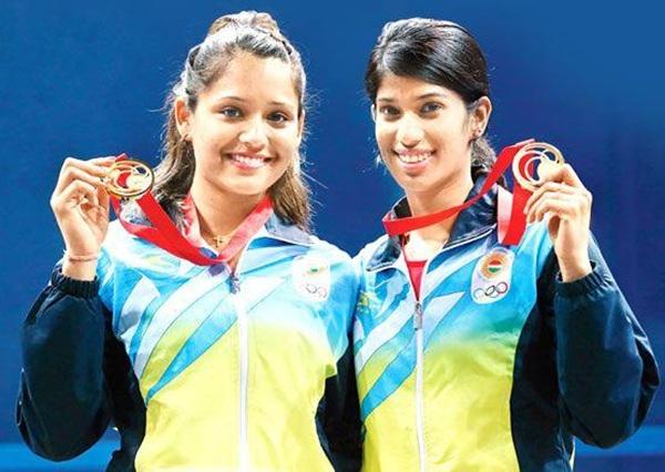 Dipika Pallikal (left) and Joshana Chinappa of India celebrate 