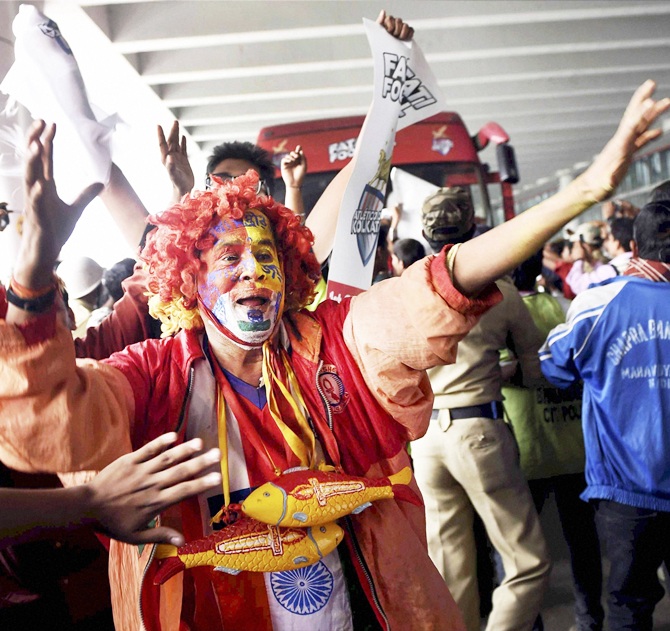 Supporters of Atletico De Kolkata football team rejoice