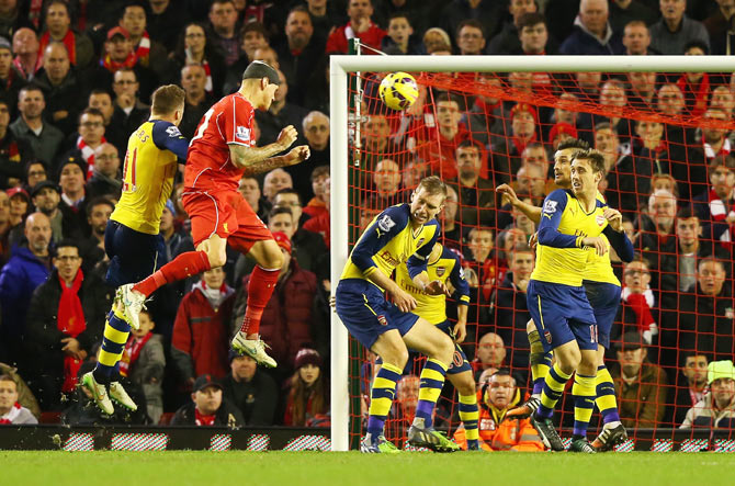 Martin Skrtel of Liverpool heads the equalising goal against Arsenal on Sunday