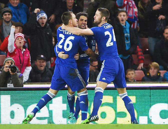  Chelsea's John Terry celebrates with Cesc Fabregas and Gary Cahill