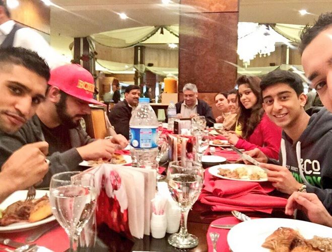 Boxer Amir Khan enjoys dinner with his family in Islamabad