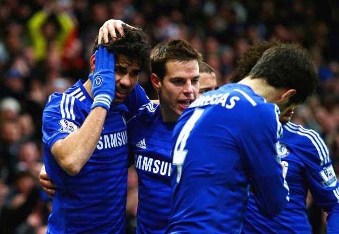 Diego Costa of Chelsea celebrates scoring their second goal with Cesar Azpilicueta during the Barclays Premier League match between Chelsea and West Ham United