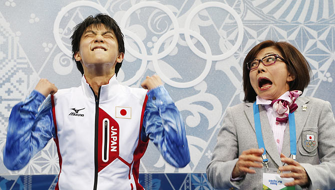 Japan's Yuzuru Hanyu reacts in the "kiss and cry" area during the Figure Skating Men's Short Program at the Sochi 2014 Winter Olympics