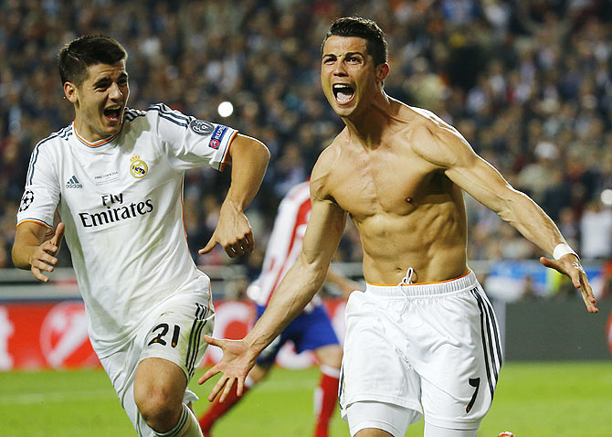 Real Madrid's Cristiano Ronaldo celebrates with teammate Alvaro Morata (left) after scoring a penalty against Atletico Madrid during their Champions League final at the Luz Stadium in Lisbon