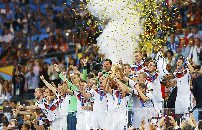 Germany's players lift the World Cup trophy as they celebrate their 2014 World Cup final win against Argentina at the Maracana stadium in Rio de Janeiro