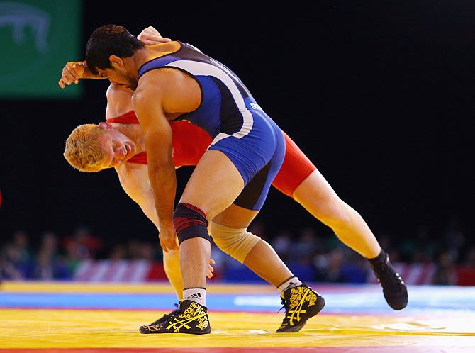   Sushil Kumar of India in action against Jayden Lawrence of Australia in the wrestling 74kg freestyle round of 16 match at Scottish Exhibition And Conference Centre during the Glasgow 2014 Commonwealth Games on July 29