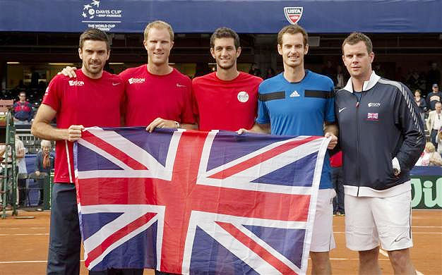 Colin Fleming, Dominic Inglot, James Ward, Andy Murray and Captain Leon Smith (GBR) pose with the British flag after defeating the USA in their Davis Cup tie at Petco Park in San Diego on Sunday