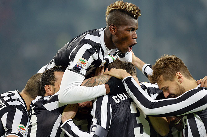 Juventus players celebrate a goal against Inter Milan on Sunday