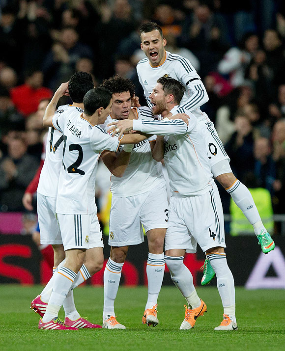 Pepe of Real Madrid celebrates scoring their opening goal with teammates during the Copa del Rey semi-final first leg match against Atletico Madrid at Estadio Santiago Bernabeu in Madrid on Wednesday