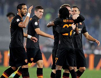 AS Roma's Gervinho (right) celebrates with teammates after scoring the opening goal against SSC Napoli during their Italian Cup match at Olimpico Stadium in Rome on Wednesday