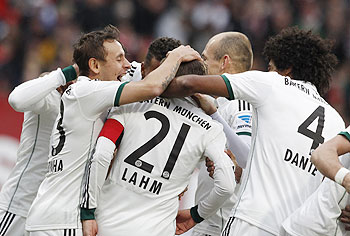 Bayern Munich's team celebrates Philipp Lahm's goal during their Bundesliga match on Saturday