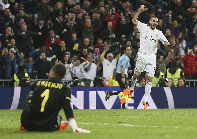 Real Madrid's Karim Benzema celebrates after scoring his second goal against Villarreal at Santiago Bernabeu stadium in Madrid on Saturday