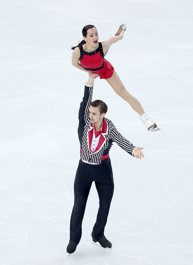 Ksenia Stolbova and Fedor Klimov of Russia compete in the Figure Skating Team Pairs Free Skating at Iceberg Skating Palace in Sochi on Saturday
