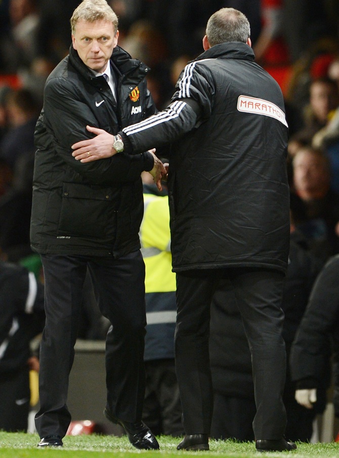 Fulham Manager Rene Meulensteen shakes hands with David Moyes of Manchester United.