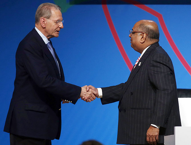 Former International Olympic Committee (IOC) president Jacques Rogge (left) greets Narayana Ramachandran on September 8, 2013