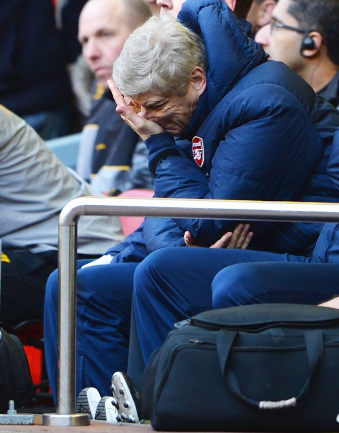 Arsenal Manager Arsene Wenger looks dejected.