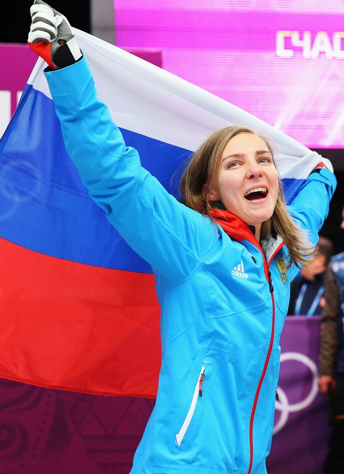 Bronze medalist Elena Nikitina of Russia celebrates during the flower ceremony for the Women's Skelton.
