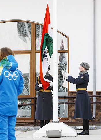 Russian soldiers raise India's national flag during the welcoming ceremony for the team in the Olympic athlete's village, which stands on a mountain plateau in Rosa Khutor, during the 2014 Winter Olympic Games on Sunday
