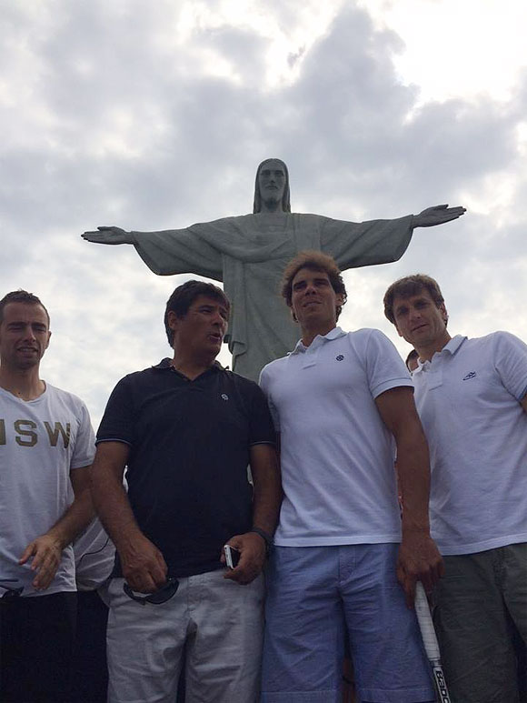 Rafael Nadal (2nd from right) and his team stand under the Christ the Redeemer statue in Rio de Janeiro on Saturday