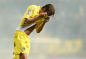 Tomas Pina of Villarreal reacts after a tear gas canister is thrown in the stands during the La Liga match between Villarreal CF and RC Celta de Vigo at El Madrigal in Villarreal on Saturday