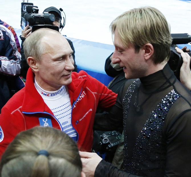 Russian President Vladimir Putin, left, greets Yevgeny Plushenko.