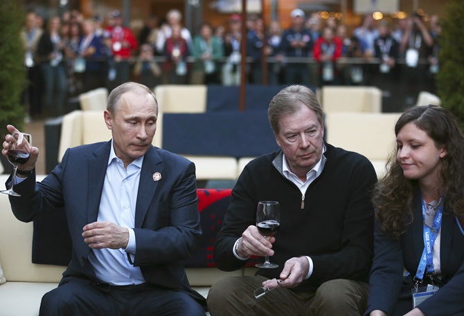 Russian President Vladimir Putin,left, and US Olympic Committee chairman Larry Probst.
