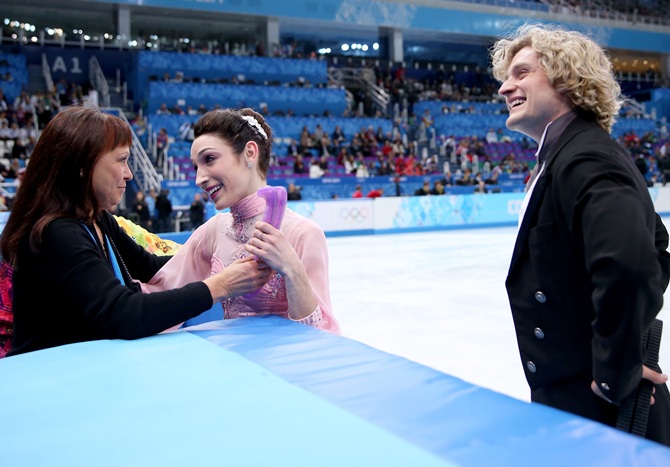 Meryl Davis and Charlie White of the United Stateswelcomed by their coach Marina Zoueva.