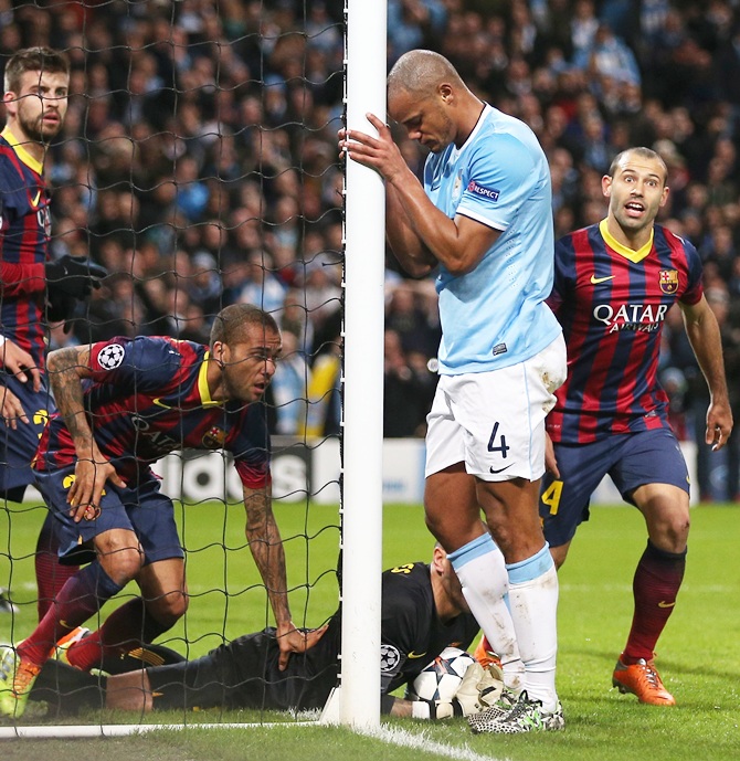 Vincent Kompany of Manchester City reacts to a missed chance during the Champions League Round of 16 first leg match against Barcelona.