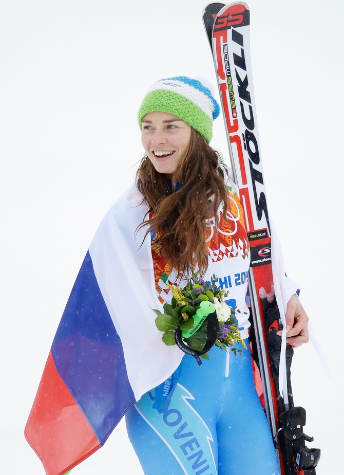 Gold medalist Tina Maze of Slovenia celebrates during the flower ceremony for the Alpine Skiing Women's Giant Slalom.