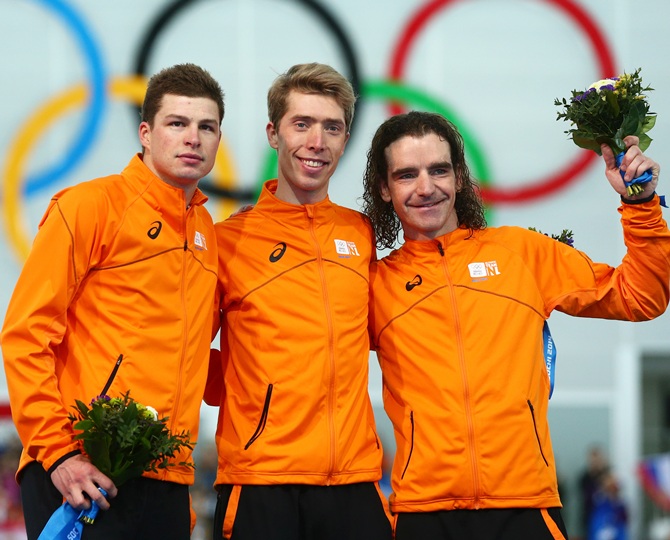 From left, Silver medalist Sven Kramer of the Netherlands, gold medalist Jorrit Bergsma of the Netherlands and bronze medalist Bob de Jong of the Netherlands celebrate.