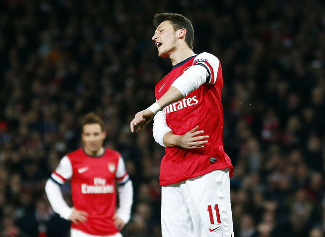 Arsenal's Mesut Ozil reacts after missing a penalty against Bayern Munich during their Champions League match on Wednesday