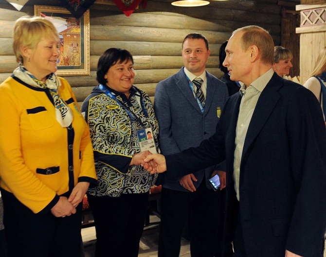 File Photo of Russia's President Vladimir Putin, centre, visiting Team Ukraine House at the Olympic Park.