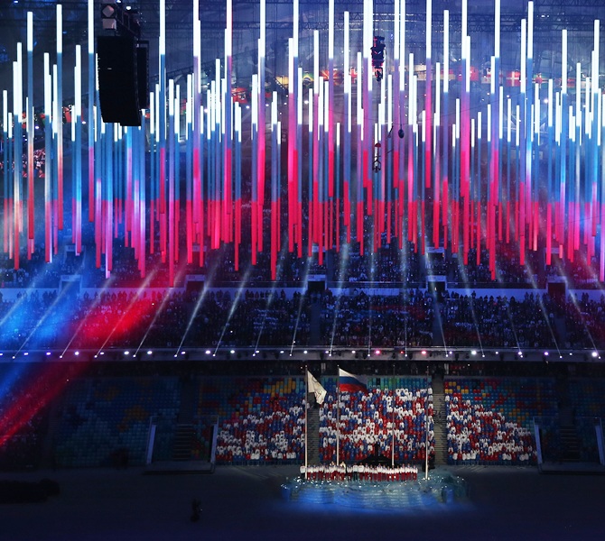 Singers perform the Russian national anthem during the 2014 Sochi Winter Olympics Closing Ceremony at Fisht Olympic Stadium.