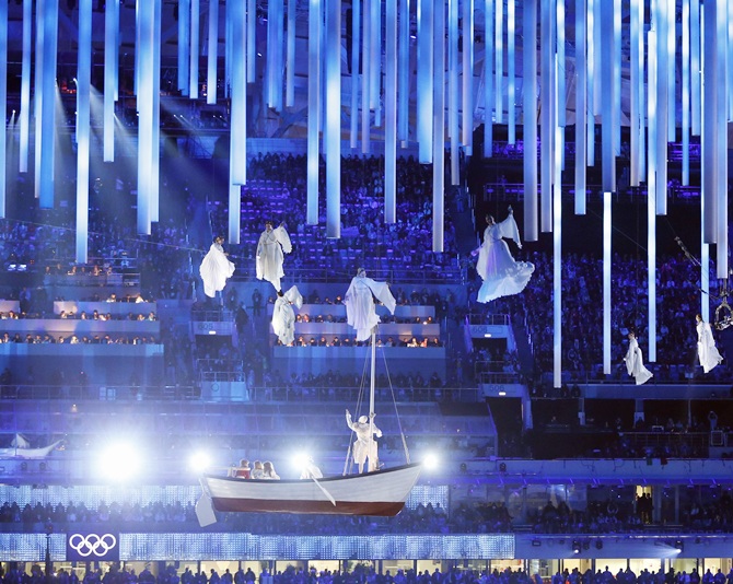 Performers and a giant rowboat are seen suspended in the air during the closing ceremony.