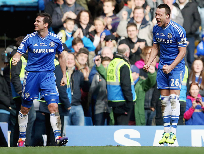 Frank Lampard of Chelsea (left) celebrates with teammates John Terry after the latter scored the winner agianst Everton at Stamford Bridge on Saturday