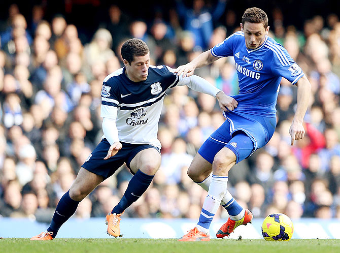 Ross Barkley of Everton (left) challenges Nemanja Matic of Chelsea during their Premier League match on Saturday