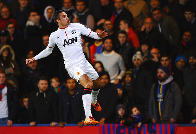 Robin Van Persie of Manchester United jumps for joy as he celebrates his goal against Crystal Palace at Selhurst Park in London on Saturday