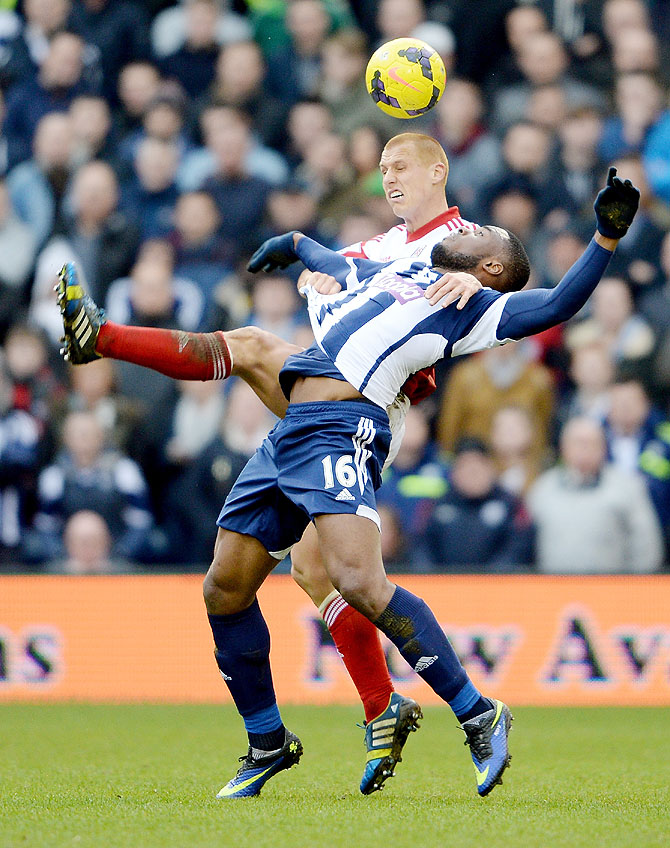 Victor Anichebe of West Brom is challenged by Steve Sidwell of Fulham during their Premier League match at The Hawthorns in West Bromwich on Saturday