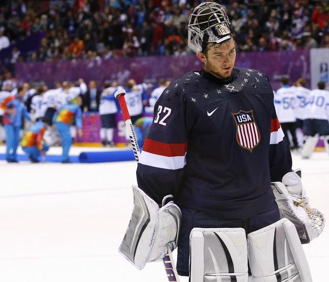Team USA's goalie Jonathan Quick leaves the ice after being defeated by Finland during the men's ice hockey bronze medal game at the Sochi.