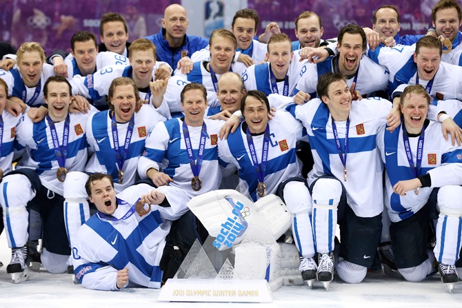 Bronze medalists Finland celebrate after defeating the United States 5-0 during the Men's Ice Hockey Bronze Medal Game.