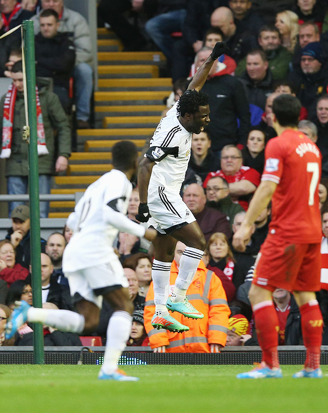 Wilfried Bony of Swansea City celebrates scoring his team's second goal during their match against Liverpool on Sunday
